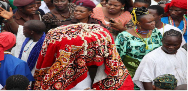 Worshipers of the Osun goddess make their way along with an unidentified virgin girl 'Arugba', center, to the river in Osogbo, Nigeria.