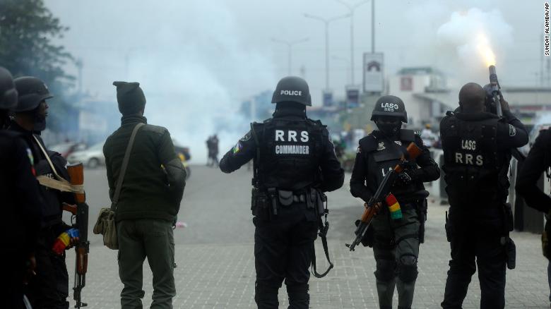 POLICEMEN DISPERSE PROTESTERS