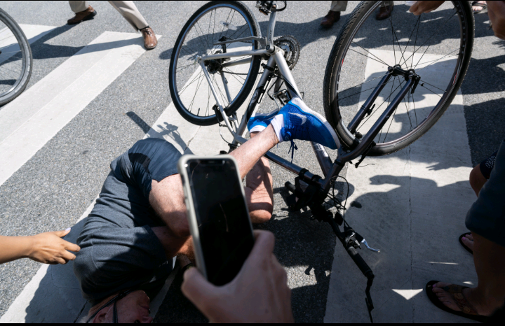 Joe Biden falls riding bicycle