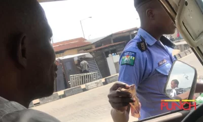 Police man collecting bribe