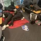 Falconets sleeping on chairs and floor at Istanbul Credit - Collin Udoh