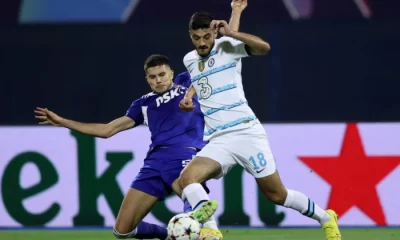 Chelsea's Albania's forward Armando Broja (R) is tackled by Dinamo Zagreb's Croatian defender Dino Peric during the UEFA Champions League Group E football match