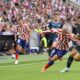 Girona's Spanish midfielder Javier Hernandez (R) vies with Atletico Madrid's French forward Antoine Griezmann during the Spanish League football match between Club Atletico de Madrid and Girona FC at the Wanda Metropolitano stadium in Madrid on October 8, 2022.