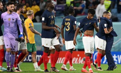 France's coach #00 Didier Deschamps (R) hugs France's forward #10 Kylian Mbappe (2ndR) after France won the Qatar 2022 World Cup