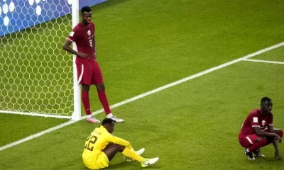 Qatar players react after the final whistle of the Qatar 2022 World Cup Group A football match between Qatar and Senegal at the Al-Thumama Stadium in Doha on November 25, 2022