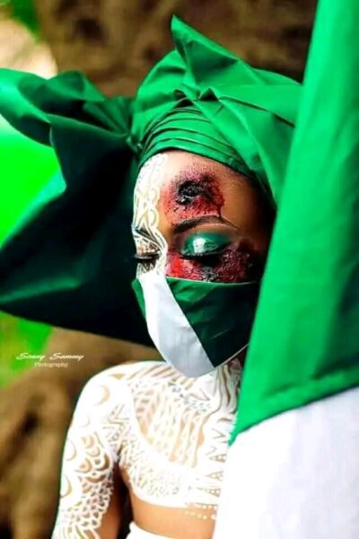 Lady wearing Nigeria flag
