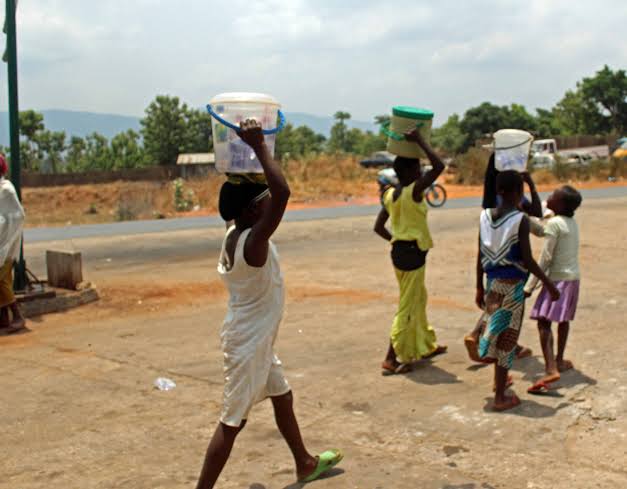 Young children hawking on the street