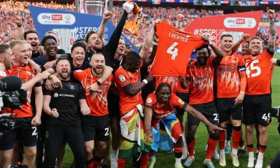 Luton Town’s players celebrate on the pitch after Luton win the penalty shoot-out in the English Championship play-off final football match between Coventry City and Luton Town at Wembley Stadium in London on May 27, 2023. – Luton won the game 6-5 on penalties after the game finished 1-1 after extra time. (Photo by ADRIAN DENNIS / AFP)