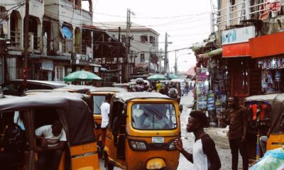 Lagos car and molue bus with Keke