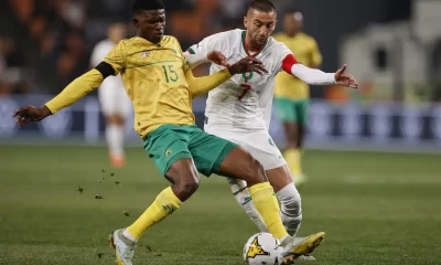 Morocco’s Hakim Ziyach (R) fights for the ball with South Africa’s Jurry Aubaas (L) during the second leg of the 2023 Africa Cup of Nations (CHAN) Group K qualifier match between South Africa and Morocco at the FNB Stadium in Johannesburg on June 17, 2023. (Photo by Phill Magakoe / AFP)