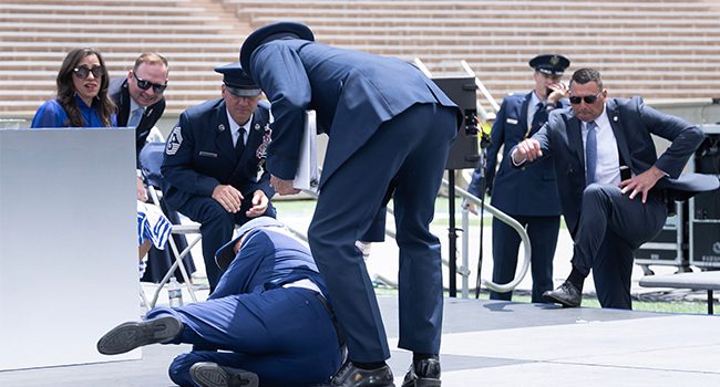 Biden trips, tumbles on Air Force stage