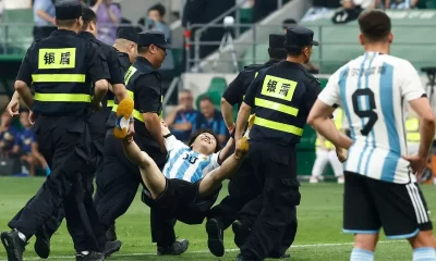 Chinese pitch invader detained after hugging Messi