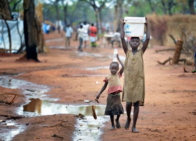 Poverty, child labour, children fetching water, north, village