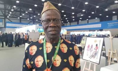 Guinea man wearing Putin's shirt