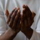 Church and worshipper - a praying hand