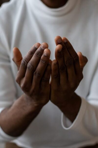 Church and worshipper - a praying hand