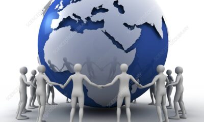 Globe and humans holding hands together