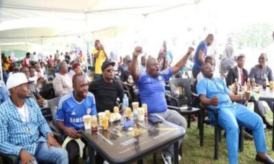 Football fans in viewing center