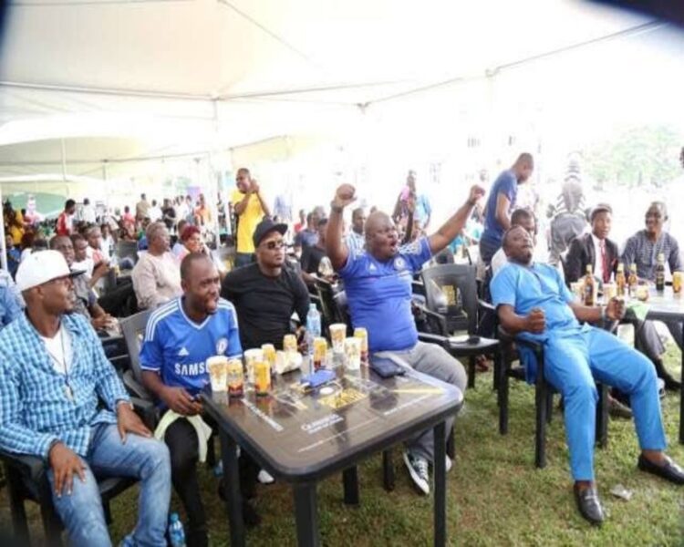 Football fans in viewing center