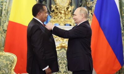Russian President Vladimir Putin hands over the Order of Honor to Congolese President Denis Sassou Nguesso