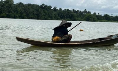 Women of Odimodi Community-woman in a boat
