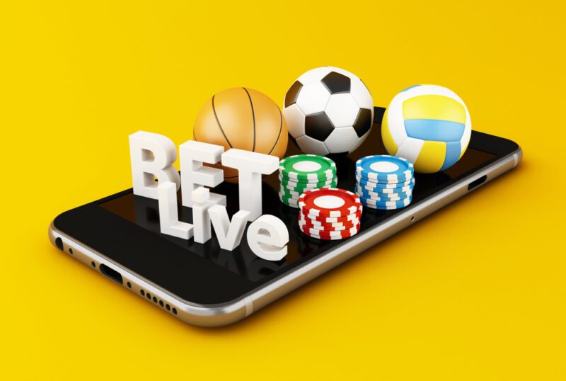 3d,Illustration.,Smartphone,With,Sport,Balls,,Chips,And,Bet,Live.