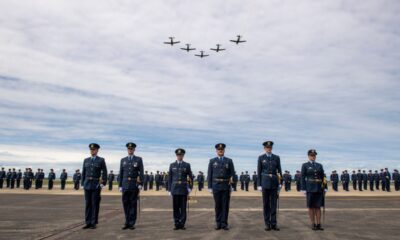 This handout photo taken on November 1, 2023 and made available on August 18, 2025 by the New Zealand Defence Force shows T-6C Texan aircraft flying above a graduating parade at the Royal New Zealand Air Force (RNZAF) Base Ohakea, located north-west of the city of Palmerston North in New Zealand. A military court found a New Zealand soldier guilty of attempted espionage for a foreign power on August 18, 2025 -- the first spying conviction in the country's history. The soldier was caught offering to pass military base maps and photographs to an undercover officer posing as an agent for the third country, the court-martial heard. (Photo by Handout / NEW ZEALAND DEFENCE FORCE / AFP) / RESTRICTED TO EDITORIAL USE - MANDATORY CREDIT "AFP PHOTO / NEW ZEALAND DEFENCE FORCE" - NO MARKETING NO ADVERTISING CAMPAIGNS - DISTRIBUTED AS A SERVICE TO CLIENTS / The erroneous mention[s] appearing in the metadata of this photo by Handout has been modified in AFP systems in the following manner: fixes restrictions. Please immediately remove the erroneous mention[s] from all your online services and delete it (them) from your servers. If you have been authorized by AFP to distribute it (them) to third parties, please ensure that the same actions are carried out by them. Failure to promptly comply with these instructions will entail liability on your part for any continued or post notification usage. Therefore we thank you very much for all your attention and prompt action. We are sorry for the inconvenience this notification may cause and remain at your disposal for any further information you may require.