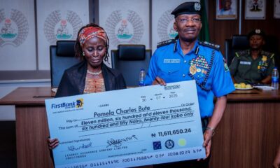 IGP Egbetokun presenting cheques
