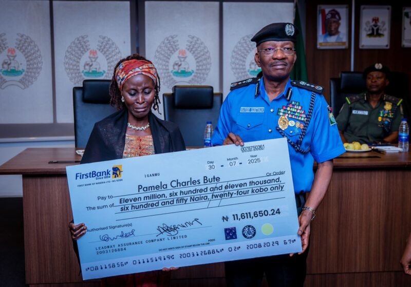 IGP Egbetokun presenting cheques